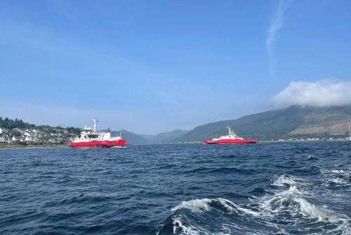 three boats in a large body of water at Dunmore Argyll House in Dunoon