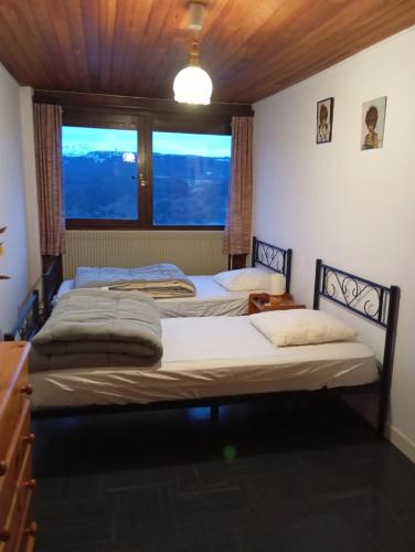 Llit o llits en una habitació de Location saisonnière