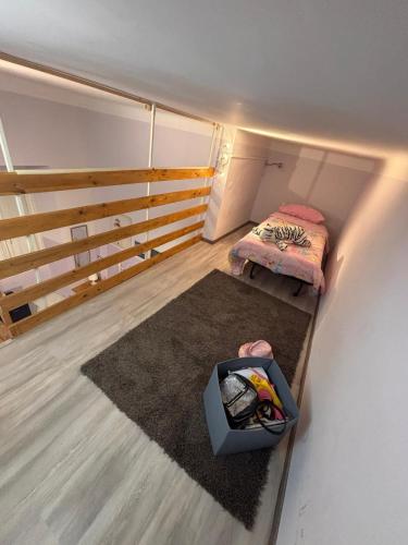 a small room with two beds and a rug at Oceania in Genoa