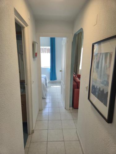 a hallway of a hotel room with a hallwayngthngthngthngthngthngthngth at Bajondillo Beach Apartment By Torremolinos On-line in Torremolinos