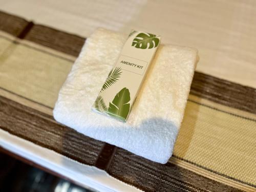 a towel sitting on top of a table at Babaland in New Agutaya
