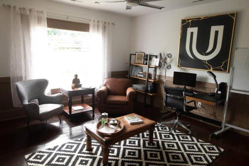 a living room with a couch and a table at ASecondU Peaceful Retreat in Salisbury