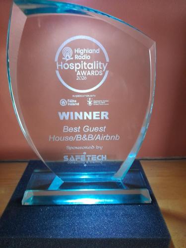 a glass award trophy on a wooden table at Wild Atlantic View Inishowen in Greencastle