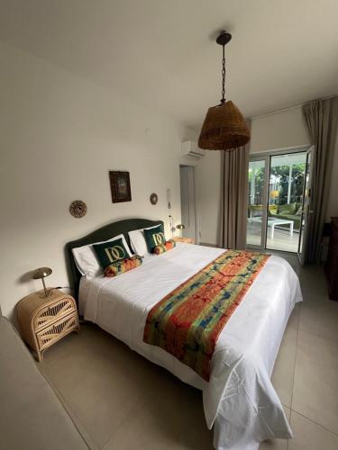 a bedroom with a large bed and a window at Domus Orestea Luxury Suites in Palermo