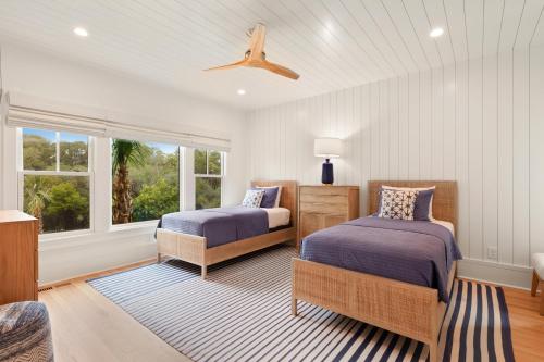 a bedroom with two beds and a window at 3 Surfsong in Kiawah Island