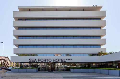 an office building with a sign for the sea porto hotel at Sea Porto Hotel in Matosinhos