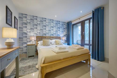 a bedroom with a bed with towels on it at Riverside Park 1 in Keswick