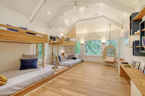 a large room with two bunk beds in it at 217 Glen Abbey in Kiawah Island