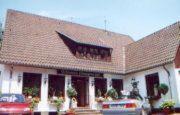 a building with a roof with a sign on it at Kämpgens – Hof in Mülheim an der Ruhr