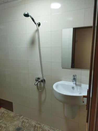 a bathroom with a sink and a mirror at Vadamar Apartment in Sisian