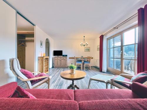 a living room with a couch and a table at Sonnenhof Seeg 08 in Seeg