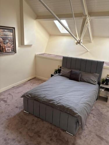 a bedroom with a large bed in a room at Dock View Lodge in Liverpool