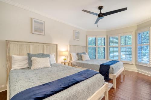 a bedroom with two beds and a ceiling fan at 5537 Green Dolphin Way in Kiawah Island