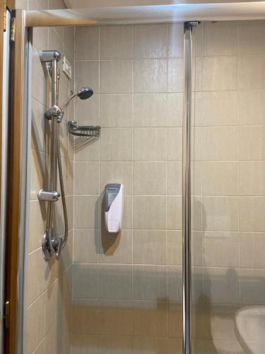 a shower in a bathroom with a glass door at Hotel Center 3 in Rome