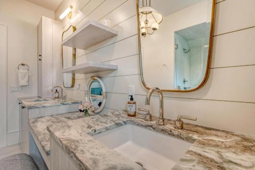 a bathroom with a large sink and a mirror at 135 Halona Ln in Kiawah Island