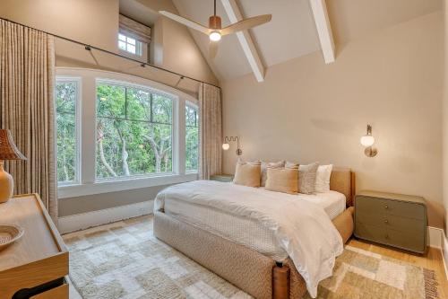 a bedroom with a bed and a large window at 135 Halona Ln in Kiawah Island