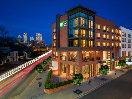 a rendering of a building at night with traffic at Holiday Inn Express & Suites - Charlotte - South End by IHG in Charlotte