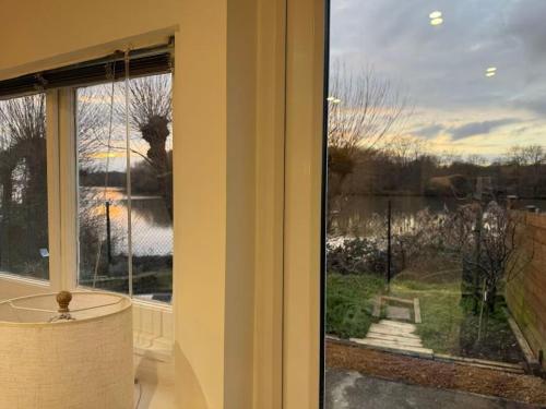 a window with a view of a yard at Lakeside Haven in The Hyde