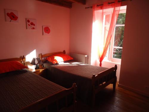 Llit o llits en una habitació de Gîte tilleul