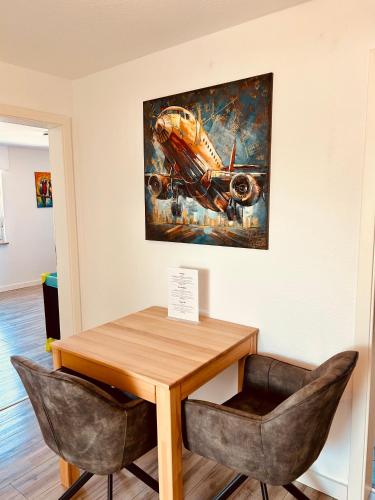a painting of an airplane hanging on a wall at Apartments Yvonne Sigg in Rust