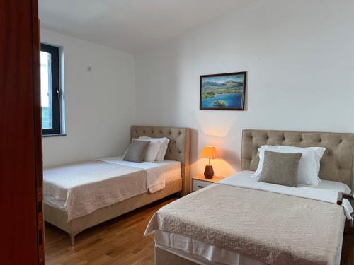 Llit o llits en una habitació de Plava Vila Penthouse