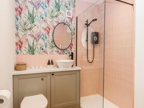 a bathroom with a shower and a sink at Shamrock in Exeter