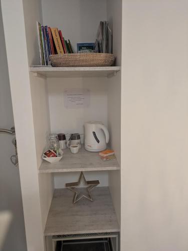 a walk in pantry with a star on a shelf at Chambre d'hôte " Ô Soleil " in Vaison-la-Romaine