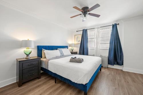 a bedroom with a bed and a ceiling fan at Atlanta North Urban Chic 2BR- 7th Floor in Atlanta