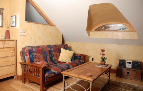 a living room with a couch and a table at Mistiso's Place Vacation Rentals in Nelson