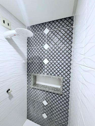 a bathroom with a shower with a mirror at Hotel Pousada-LG in Breves