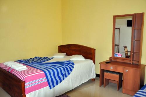 Postel nebo postele na pokoji v ubytování Hotel Pearl Gate