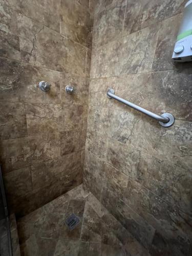 a bathroom with a shower with a tiled shower at Loft A cerca zona dorada in Mexicali