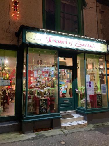 a store front of a restaurant at night at The Wendy House in Walton-on-the-Naze