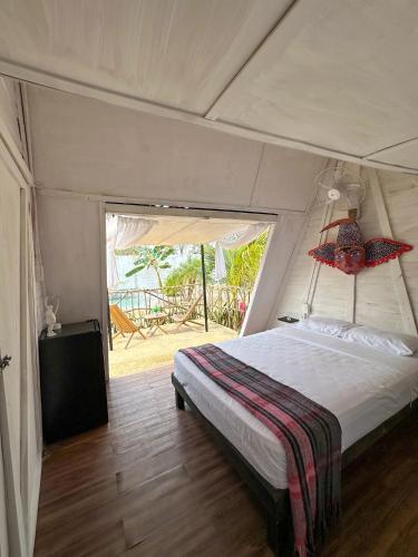 a bedroom with a bed in a tent at Las siete lunas in Ucú