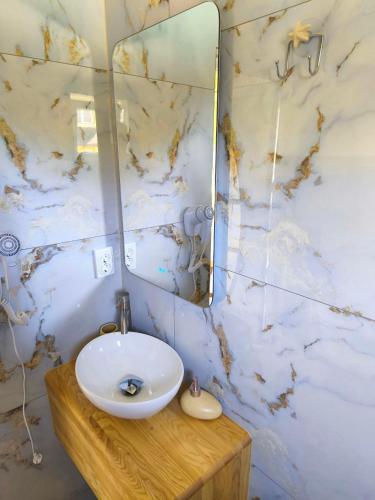 a bathroom with a white sink and a mirror at Славський Двір in Slavske