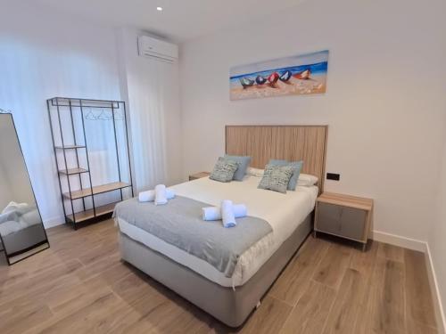 a bedroom with a bed with two pillows on it at Urdaibai Gernika Stages in Guernica y Luno