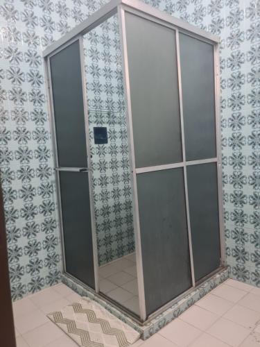 a shower stall with glass doors in a bathroom at Casa do Lago Triunfo in Triunfo