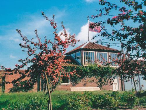 a building with a flag on top of it at Deer Park Lookout - E3928 in Thorpe Market