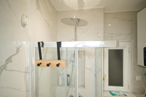 a bathroom with a shower with a glass shower stall at Nissa la bella in Nice
