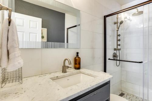 a bathroom with a sink and a shower at Infinity Edge Pool & Fire Pit: Spicewood Getaway! in Spicewood