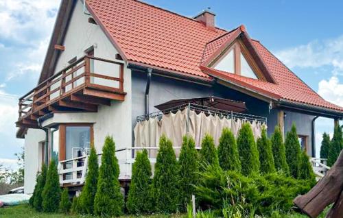 a house with a red roof and a fence at Stunning Home In Rybical With Wifi in Rybical