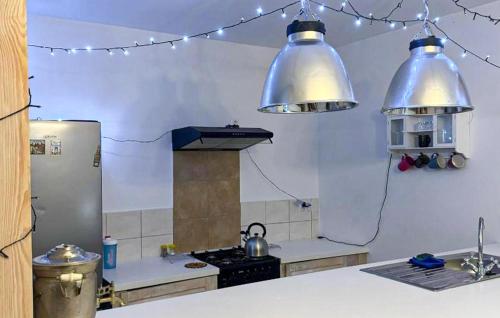 a kitchen with two large lights above a stove at Stunning Home In Rybical With Wifi in Rybical