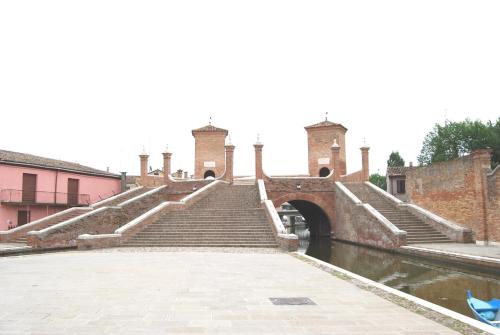 a set of stairs in front of a bridge at Hotel Rurale Canneviè in Lido di Volano