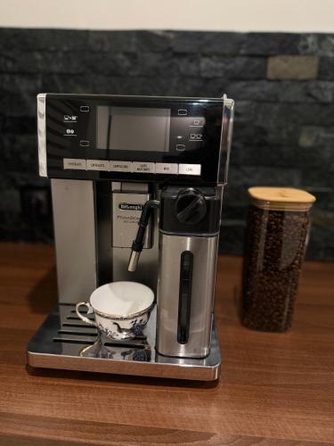 a coffee maker sitting on top of a table at Dom na Styku in Jaworzynka
