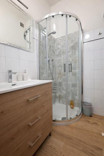 a bathroom with a shower and a sink at Casa Camelia in Scarperia