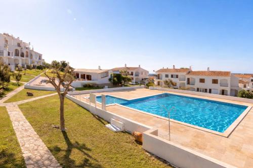 an image of a swimming pool in a villa at EcoHome Menorca in Cala en Porter