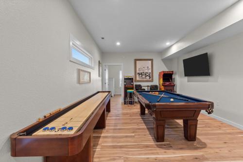 two pool tables in a room with a tv at 5725 - A Dream Vacation in Nags Head
