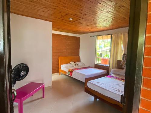 Llit o llits en una habitació de Villa Natalia