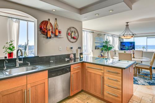 a kitchen with a sink and a dishwasher at Beachfront, Amazing 180-Degree View in Oceanside