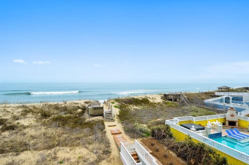 a view of the beach from the balcony of a house at 4099 - 3-2-1 Relax in Duck
